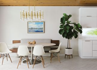 Eames fiberglass chairs circle Saarinen’s oval dining table in the casual breakfast area, where a custom banquette fabricated by Stettinius Construction appears to float next to S&W Kitchen Supply’s sleek, white cabinetry.