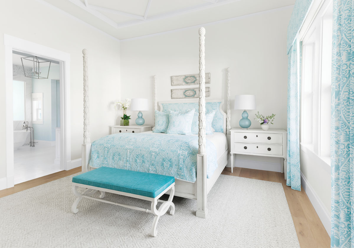 Seventeenth-century Italian panels hang above the four-poster bed in the master bedroom. The bedding fabric is by Quadrille. &ldquo;We wanted to keep the color palette consistent throughout the house,&rdquo; Thompson says. The view from the en suite bathroom looks out over the Gulf of Mexico.