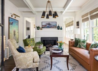 Vintage Charm Abounds in 1920s-Era Bungalow A brown leather sofa is the grounding element in the front living room. The Moroccan rug was used to anchor the space and add texture. The fireplace was completely redesigned with black slate.