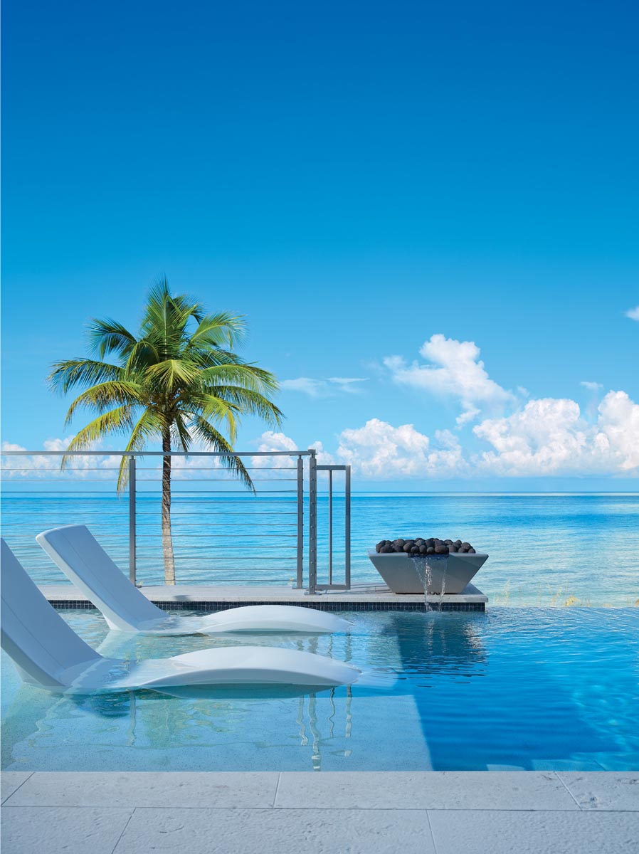 The home was required to be more than 14 feet above the sand per Florida&rsquo;s hurricane codes, so the architectural team worked with Christian Andrea of Architectural Land Design in Naples to design an elevated pool that appears to flow directly into the Gulf of Mexico.