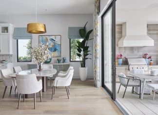 An ideal illustration of indoor/outdoor living from designer Sherie Weidner of Clive Daniel Home, this view of the living room features a dining set from Adriana Hoyos and a console from Century. On the outdoor dining area, furniture from Brown Jordan makes alfresco meals a pleasure.