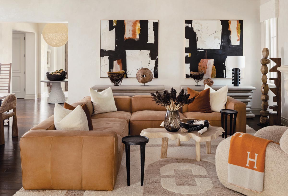 &ldquo;They wanted something very cushy,&rdquo; says Blackshaw of the lounge room&rsquo;s furniture. &ldquo;We used a cloud-like leather sectional that you just sink into.&rdquo; The boucl&eacute; pillows and armchair emphasize comfort. The organic coffee table is handmade. William McLure paintings tell the home&rsquo;s color story.