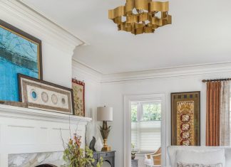 Retro Revamp for Colonial-Style St. Petersburg Home Central to the living room is the fireplace, which was outfitted with Calacatta Gold marble. “It’s a stone that you will see in historical homes as well as current motif homes, so it is truly timeless,” says designer Michelle Miller.