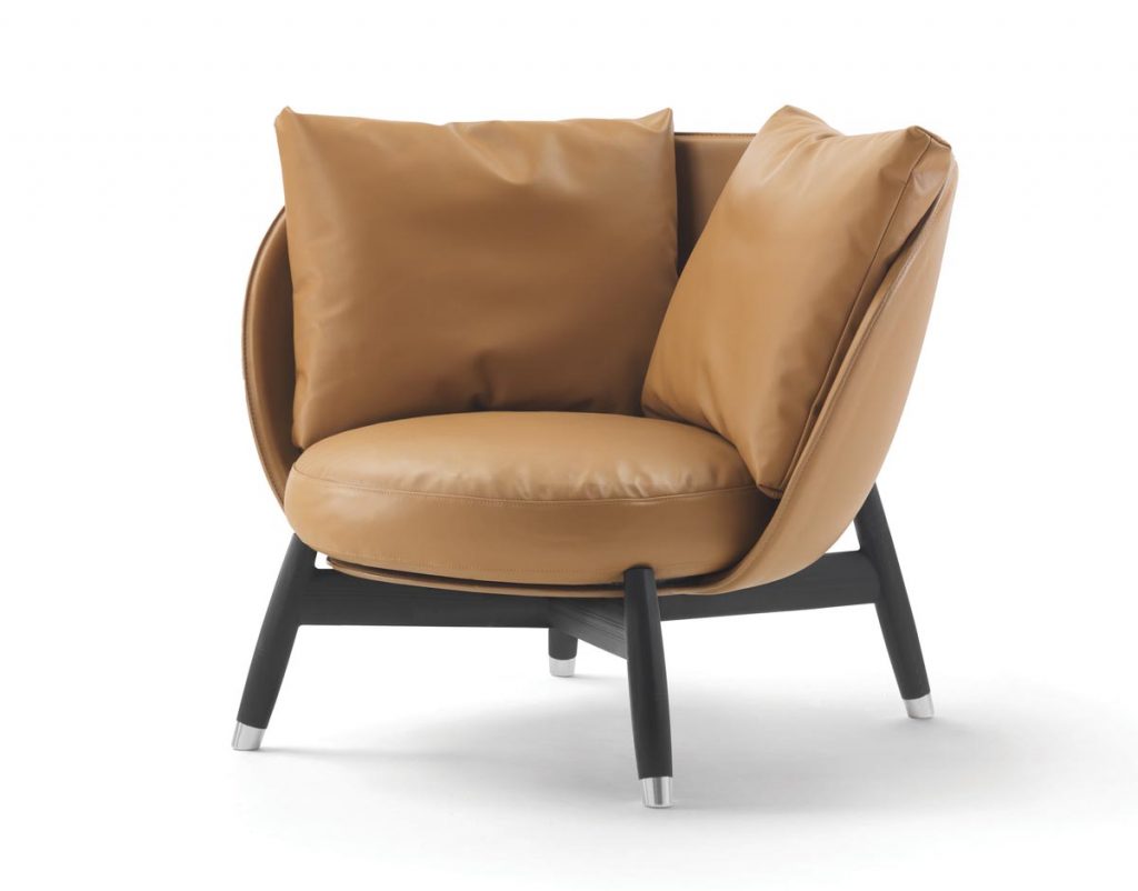 Designed by Fumie Shibata for Flexform, the Eri armchair’s hand-turned legs support an upholstered shell with a soft goose-down-filled seat and backrest cushions