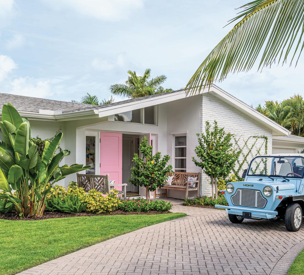 Mid-century modern lines, an updated motor court, and a happy pink front door hint at the whimsy to be found inside this renovated 1960s ranch-style cottage in Naples&rsquo; Aqualane Shores neighborhood.