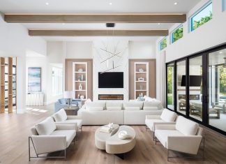 Homegrown Style in Naples’ Pelican Bay Vanguard Furniture’s Lucca sectional was chosen to complement the recessed wall detail the design team created for the great room. Book-matched porcelain tiles surround the fireplace. A nearby conversation area with chairs from Fairfield and a freeform coffee table from Four Hands make good use of the space.
