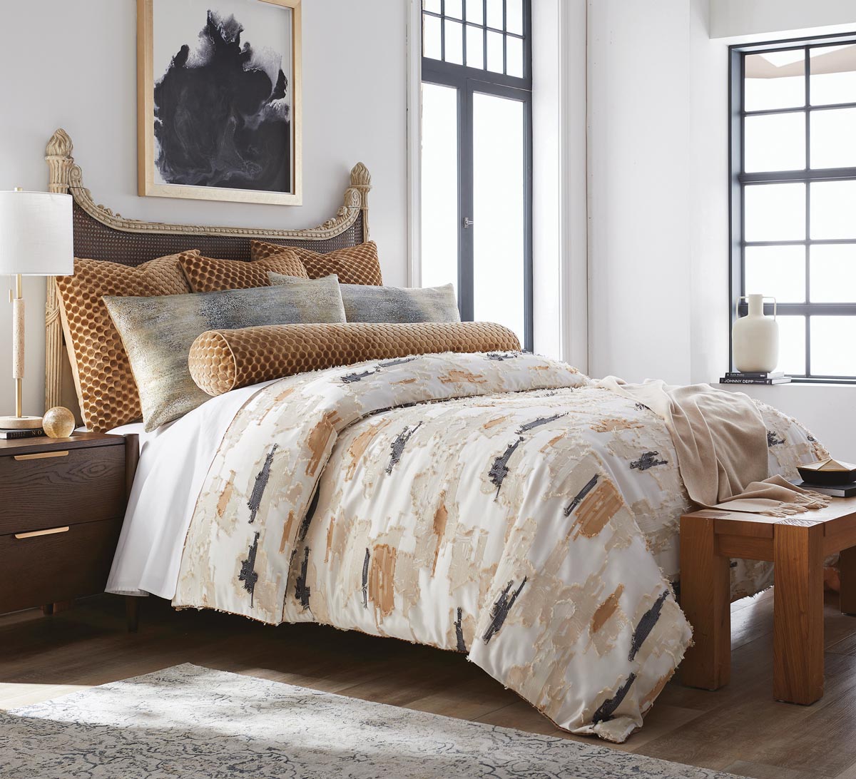 BBH&rsquo;s Nola bedding collection includes a jacquard duvet, a baby alpaca throw, an embossed velvet booster, and two types of decorative pillows. Photo courtesy of Barrett Bergmann Home