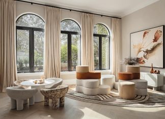 “Because the kid’s lounge is open to the main living room, we didn’t want it to feel like a chaotic playroom,” says Joy. “We treated it like a lounge that happens to be for children, and we actually have a ‘dirty playroom,’ similar to a dirty kitchen, where all the clutter lives.” The artwork is by Atlanta artist Heather Bird Harris.