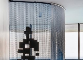 In a Sunny Isles Beach condo residence at Porsche Design Tower, a cubist figure by sculptor Antony Gormley is one of the highlights of the modern art collection that designers Sabrina MacLean and Carola Hinojosa helped the homeowners curate.