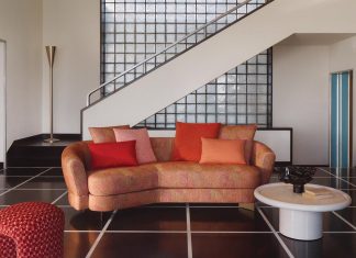 Rubelli’s Luce collection of indoor fabrics include Vitrail in Melograno (on the pouf) and Kaleidoscope in Melograno (on the sofa)