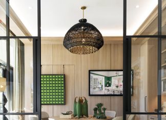A section at Anthony Catalfano Curated showcases a custom Keith Fritz dining table, a sculpture from Jonathan White Pottery and a 1954 painting by Paula Kadunc