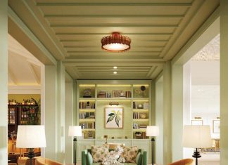 Champalimaud Design was responsible for the Naples Beach Club’s interiors, including the silvery green library section of the lobby.