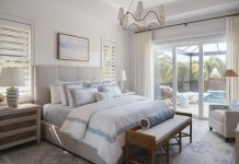 The primary bedroom layers soft blues, textured fabrics, and carefully selected Vanguard pieces for a restful vibe. Linen and grass-cloth finishes add depth without weight, while wood casing around the doors and windows brings definition.