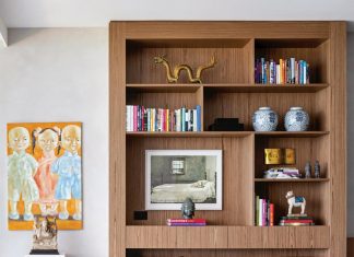 Q&A with Designer Daniela Saliba An Asian artwork in the living room nods to the time the family spent in China. A custom oak shelf holds mementos and antiques collected by the homeowners over the years. The vintage Poltrona Mole chair and ottoman by Sergio Rodrigues reveals Saliba’s penchant for Brazilian mid-century modern furniture.