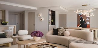 The design approach in the living room was to create a contemporary yet inviting space layered with softness and a touch of romanticism. The curved forms were intentional to soften the architecture and introduce a sense of fluidity and elegance. “The artwork by Eduardo Rezende immediately resonated with us,” says designer Jessica Jaegger, who helped the homeowners curate the collection in the residence. “It has a quiet, melancholic quality that brings a sense of introspection and calm and enriches the overall ambiance.”