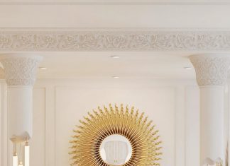 The Newton bathtub by Maison Valentina is finished in dramatic white lacquer and gold-plated accents that immediately catch the eye
