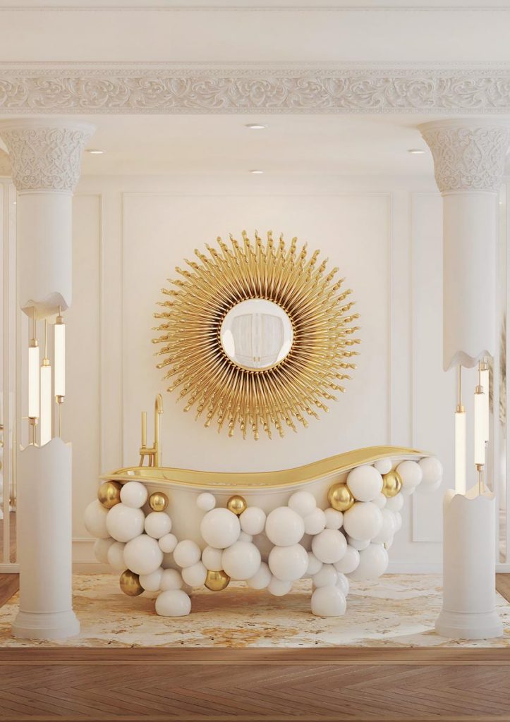 The Newton bathtub by Maison Valentina is finished in dramatic white lacquer and gold-plated accents that immediately catch the eye