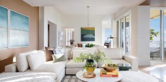 The family room is grounded by a rich area rug designed by C2 Concepts Interiors. “The client loves having family over, so the space needed to feel open and comfortable,” says Crispino. “Nothing too formal, just a layout that allows people to gather naturally.” Filled with light, the room centers around an inviting sectional sofa from Four Hands.