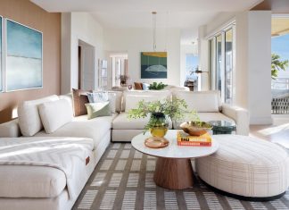 Key Biscayne Condo is a Piece of Paradise The family room is grounded by a rich area rug designed by C2 Concepts Interiors. “The client loves having family over, so the space needed to feel open and comfortable,” says Crispino. “Nothing too formal, just a layout that allows people to gather naturally.” Filled with light, the room centers around an inviting sectional sofa from Four Hands.