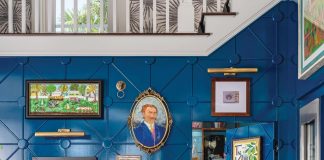 The bar is a showcase for artworks collected over the years. The mix of deep blue on the wall paneling and yellow on the stools is exemplary of the bold approach to palette exhibited throughout the residence.