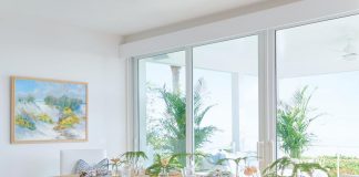 “This dining room was tricky and narrow as it’s between the kitchen and the deck,” says designer Brooke Sabia. “It is a main area for the family, so we had to ensure that it was not just beautiful but practical as well. The chairs are vintage with custom cushions, and the dining table was custom-made in Maine.”