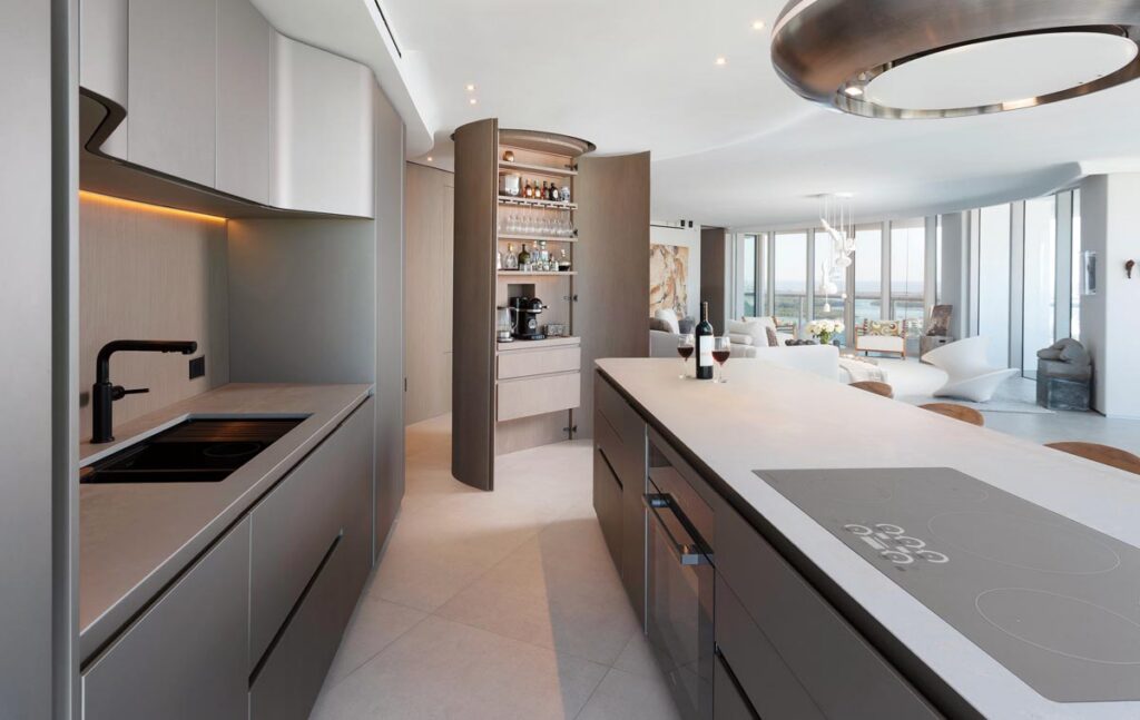 Snaidero’s Ola kitchen was selected for its light-reflecting walnut cabinets and quartz countertops. 