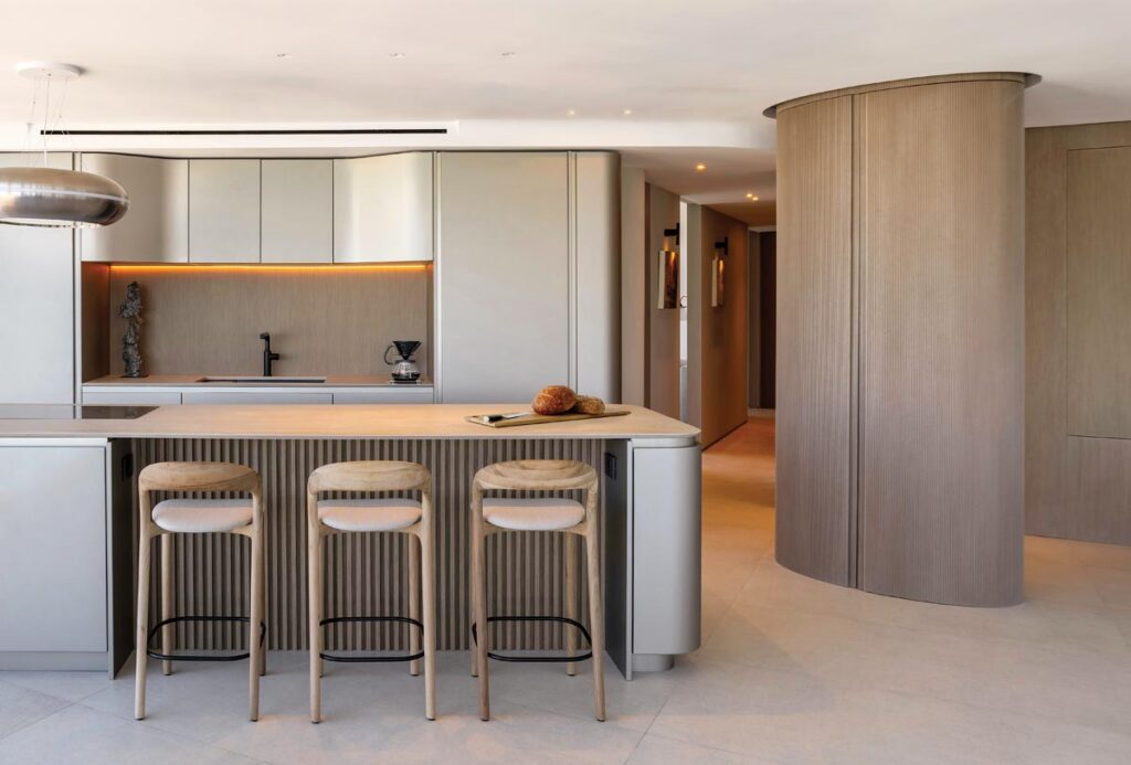Snaidero’s Ola kitchen was selected for its light-reflecting walnut cabinets and quartz countertops. 