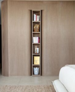 “The intention with this narrow shelf, which separates the primary bedroom’s sleeping quarters from the dressing area, was to make it a surprising millwork element,” says Salazar. “It’s almost invisible as you enter the room, but you can’t help but be drawn to it once you notice it.”