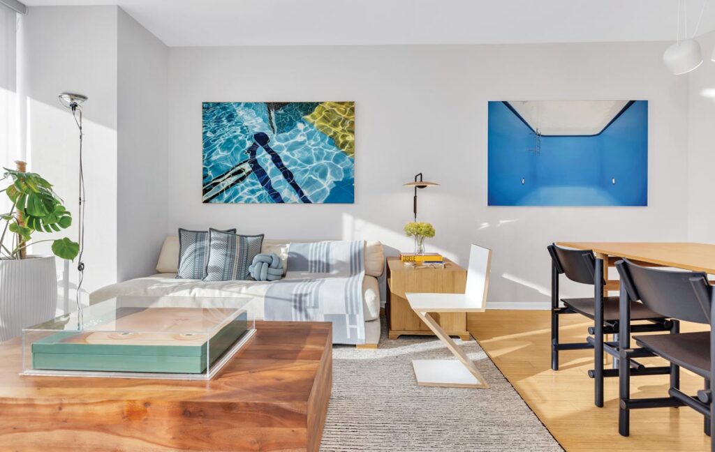 The living and dining areas of the residence were designed as one continuous space where both coexist naturally while still maintaining their intended functions. Maritza Caneca’s artworks perfectly capture the essence of Miami with color and light.