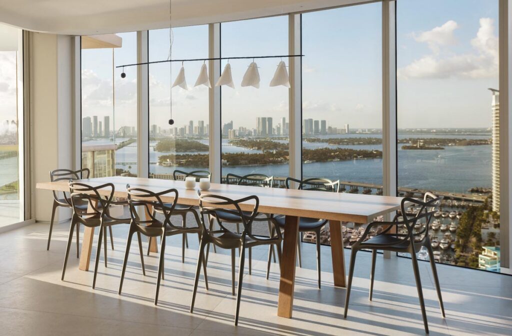“We aimed to make the dining room as light as possible so the view would remain the focal point,” says Peribere. “The pieces here include a white oak table that seats 14, Masters chairs by Kartell, and a steel and washi paper chandelier by Celine Wright that resembles a Calder mobile sculpture.”