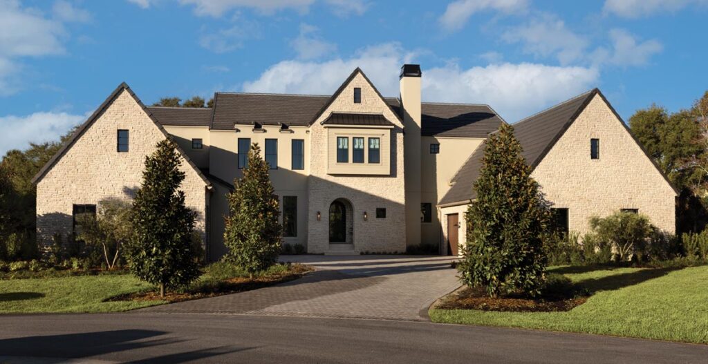 The design of the house by architect Dan DeLong draws from Tudor Revival influences without becoming a literal reproduction.