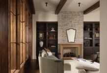 Q&A with Winter Park Designer Ashley Martin The furnishings and materials in the living room create warmth and intimacy while allowing the natural light and sight lines throughout the home to remain the focus. The fireplace surround was fabricated from a precast material with a limestone façade. The Champagne Cobble brick above it was selected for its vintage look. Crafted from oak and finished in a rich stain, the built-in shelves display cherished accessories, books, and mementos.