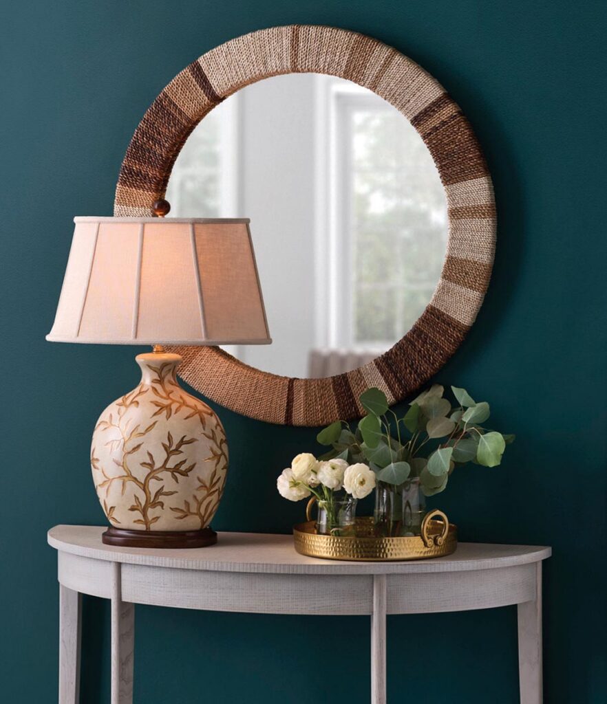 A foyer vignette displays the Bradford ceramic lamp and Calusa mirror by Wildwood