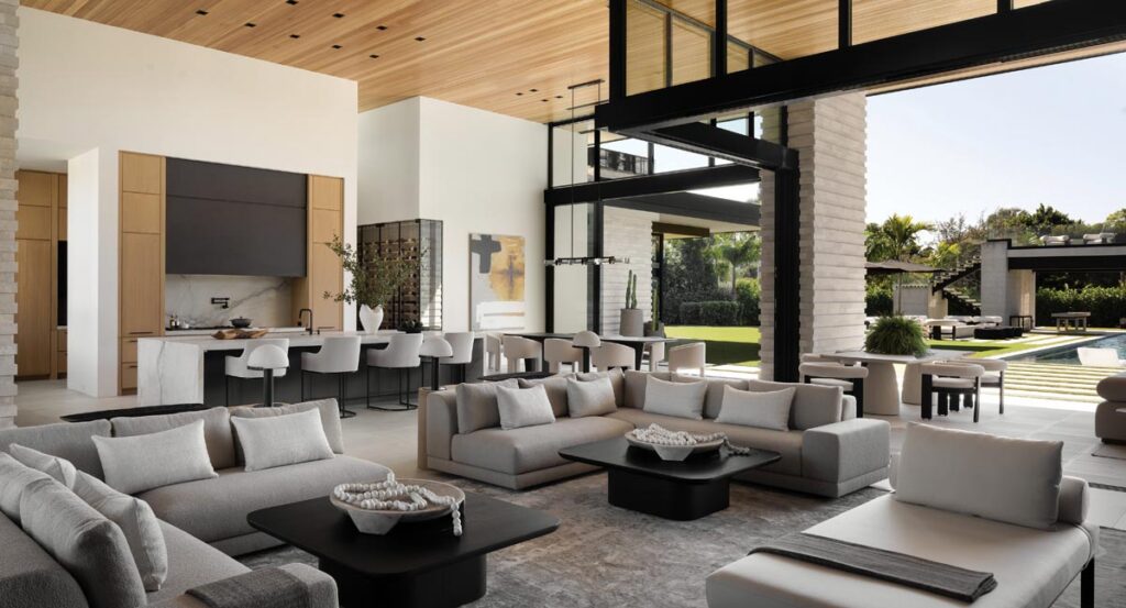 The design team incorporated multiple dual-facing seating arrangements from RH to delineate distinct gathering areas without disrupting the open sightlines of the home’s grand room. 