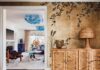 Eclectic Palm Beach Home is a Study in Pattern and Texture The foyer establishes the residence’s maximalist point of view with a hand-beaded de Gournay wallcovering and a massive woven console and lamp by Katie Stout. In the living room beyond, Murano glass Flower chandeliers by Studio Glustin immediately catch the eye.