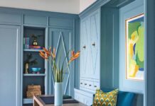 “The office/den was designed to make the most of the ocean view with the desk intentionally positioned to face the water,” says Gaddis. “Custom cabinetry in the same serene teal blue used throughout the home creates continuity.”
