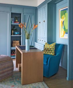 “The office/den was designed to make the most of the ocean view with the desk intentionally positioned to face the water,” says Gaddis. “Custom cabinetry in the same serene teal blue used throughout the home creates continuity.”